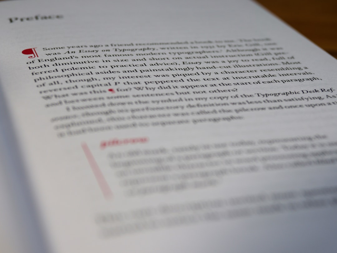 Close-up of a laptop and notebook with a proposal document on screen